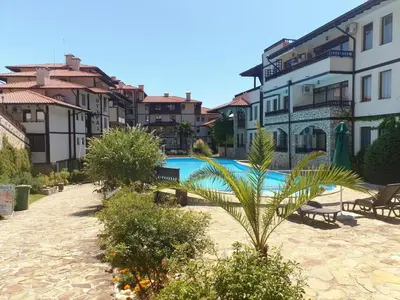 a swimming pool in a courtyard of a building at Апартамент с фронтална гледка море in Sveti Vlas