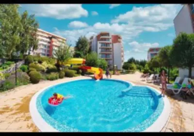 a swimming pool with a toy in the water at 2-комнатные апартаменты у моря 10 бассейнов Crown Fort Noks in Sveti Vlas