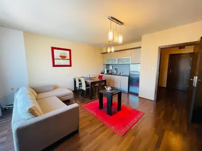 a living room with a couch and a table at Luxury apartment whit sea view at Sunny Beach in Sunny Beach