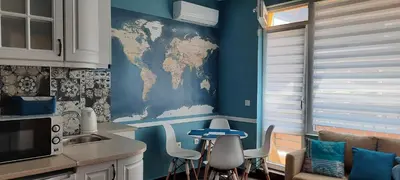 a kitchen with a map of the world on the wall at Нава 8 in Burgas City