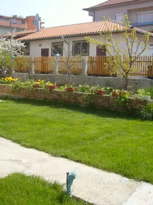 a fire hydrant in the yard of a house at Сотирови, самостоятелни стаи in Chernomorets