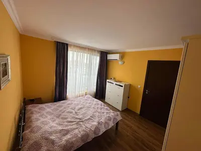 a small bedroom with a bed and a window at Sirena in Sveti Vlas