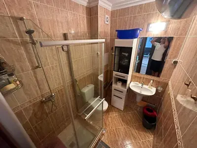 a person taking a picture of a bathroom at Sirena in Sveti Vlas