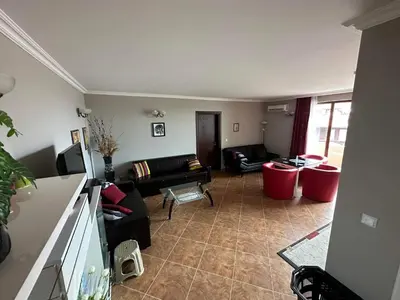 a living room with a couch and a table at Sirena in Sveti Vlas
