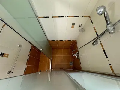 a bathroom with a shower and a ceiling at Amrita apartments Nessebar in Nesebar