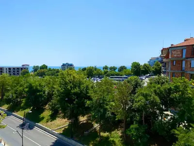 an overhead view of a city with trees and a street at Amrita apartments Nessebar in Nesebar
