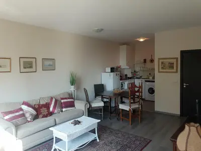 a living room with a couch and a table at Lilly apartment Pomorie in Pomorie