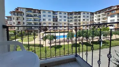 a balcony with a view of a park and buildings at Apolon 8 Relax Studio with Pools in Sunny Beach