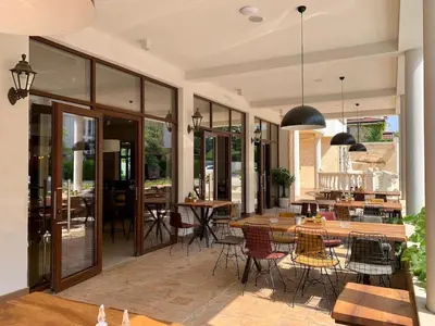 a dining room with a table and chairs at Apolon 8 Relax Studio with Pools in Sunny Beach