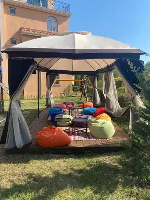 a group of chairs under a gazebo at Hacienda Beach complex- Nicoleta apartment in Sozopol