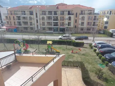a yard with a playground in front of a building at Paradise Dreams - Bulharske More - Sveti Vlas in Sveti Vlas