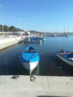 three boats are docked in the water in a harbor at Studio in the center of Sarafovo in Burgas City