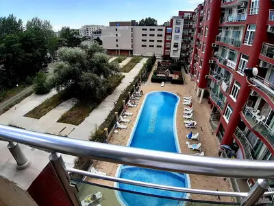 a view of a swimming pool from a balcony at Глобал вил in Sunny Beach