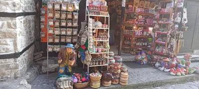 a woman standing in front of a store with a display at Глобал вил in Sunny Beach