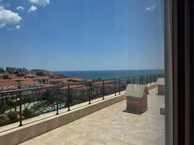 a balcony with a view of the ocean at Fenix Apart Complex in Sveti Vlas