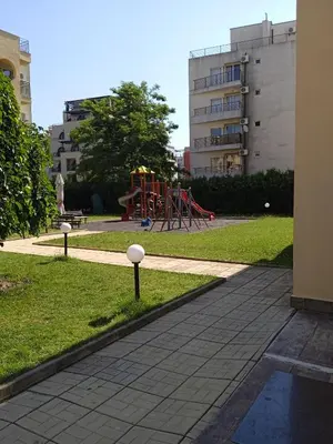 a playground in a park with a playground at Big comfortable apartment with 2 bedrooms Pollo Resort Sunny Beach in Sunny Beach