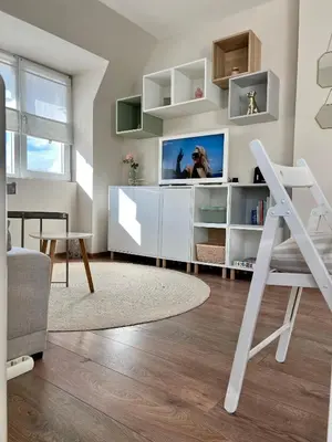 a living room with a tv on a wall at Dockview atelier in Burgas City