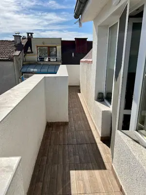 a balcony with a view of a house at Dockview atelier in Burgas City