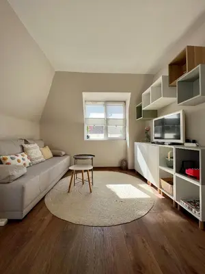a living room with a couch and a table at Dockview atelier in Burgas City