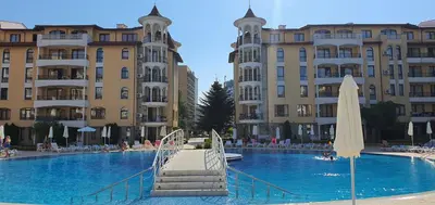 a large swimming pool in front of some buildings at Royal Sun Premium Apartment in Sunny Beach