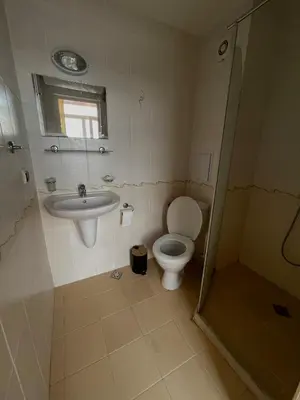 a bathroom with a toilet and a sink at Bella Apartment - Holiday Complex Rainbow in Sunny Beach