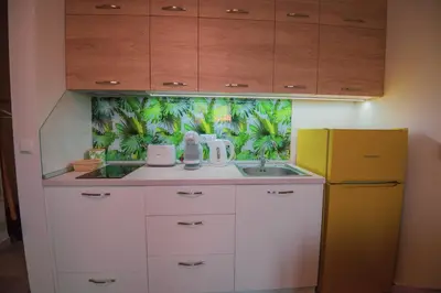 a kitchen with a sink and a yellow refrigerator at Romantic Getaway 1-BD Apartment with Sea View by Flat Mаnаger in Sozopol