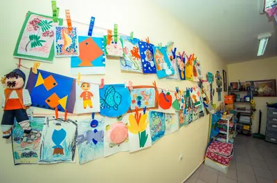 a room with a wall full of childrens kites at Panorama Fort Beach in Sveti Vlas