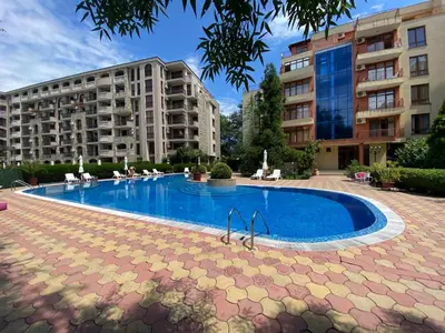 a swimming pool in front of two buildings at ANITA C 19 Apartment Sunny Beach in Sunny Beach