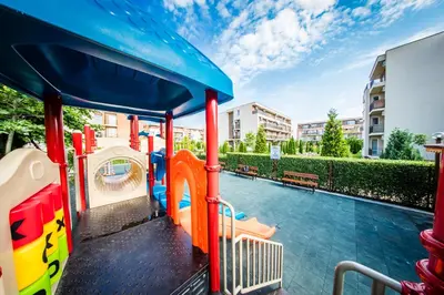 a playground with a slide and a water park at Orchid Fort Garden in Sunny Beach