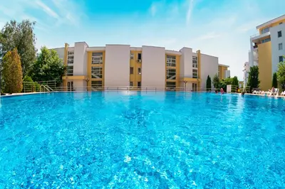 a large swimming pool in front of a building at Imperial Fort Club in Sveti Vlas