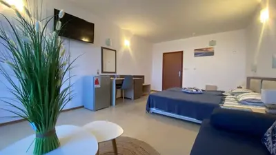 a room with a bed and a couch and a table at ESPERANTO 402 Large Studio Sunny Beach in Sunny Beach