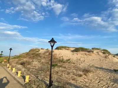 a street light on the side of a beach at ESPERANTO 403 Large Studio Sunny Beach in Sunny Beach