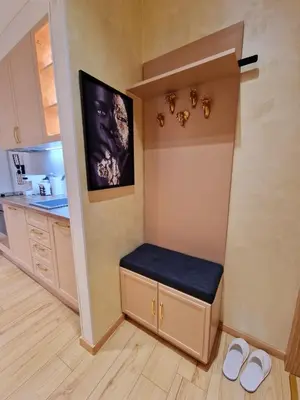 a small kitchen with a bench in the corner at FS Apartments Varna - Beautiful apartment in the center of Varna in Varna City
