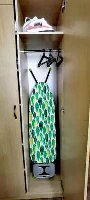 a surfboard in a drawer in a cabinet at F 207 Primorsko del Sol - просторно студио с кухня in Primorsko