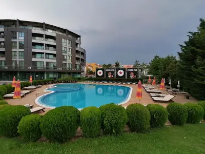 a large swimming pool in front of a building at SUNNY BEACH PLAZA Apartments in Sunny Beach