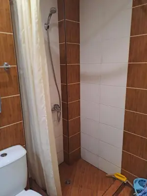 a bathroom with a shower and a toilet at SUNNY BEACH PLAZA Apartments in Sunny Beach