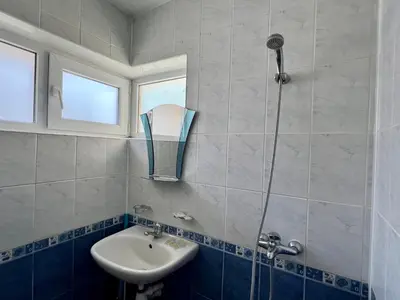 a bathroom with a sink and a shower at Private One-Bedroom Apartment with Balcony in Sozopol by Flat Mаnаger in Sozopol