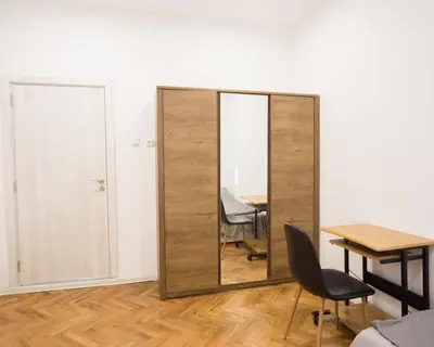 a room with a table and a mirror at Aleks Sunrise -Top Center ,Sea Garden in Burgas City