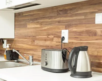 a tea kettle on a kitchen counter next to a sink at Aleks Sunrise -Top Center ,Sea Garden in Burgas City
