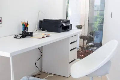 a white desk with a printer on top of it at Happy-U house - Modern and with stunning view in Chernomorets