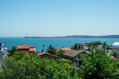 a large body of water with houses and trees at Happy-U house - Modern and with stunning view in Chernomorets