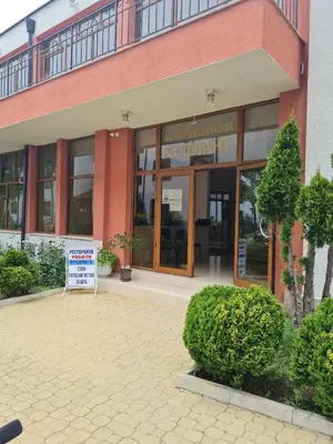 a large building with a sign in front of it at Famagusta Antoniya in Aheloy
