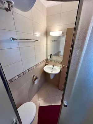 a small bathroom with a sink and a toilet at Summer Breeze 515 Studio NO ROMANIA in Sunny Beach