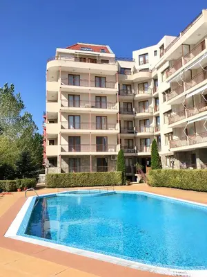 a hotel with a swimming pool in front of a building at Summer Breeze 515 Studio NO ROMANIA in Sunny Beach
