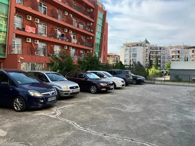 a row of cars parked in a parking lot at Summer Breeze 515 Studio NO ROMANIA in Sunny Beach