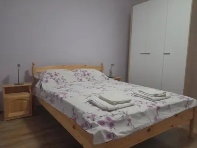 a bedroom with a bed with two towels on it at Summer Burgas Appartment in Burgas City