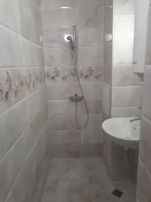 a bathroom with a shower and a sink at Summer Burgas Appartment in Burgas City