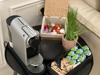 a coffeemaker on a table next to a couch at Castro Mesembria Boutique Hotel in Nesebar