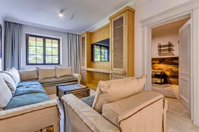 a living room with two couches and a fireplace at Castro Mesembria Boutique Hotel in Nesebar