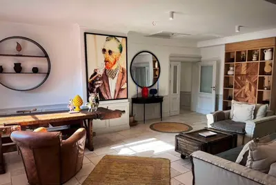a living room with a couch and a table at Castro Mesembria Boutique Hotel in Nesebar